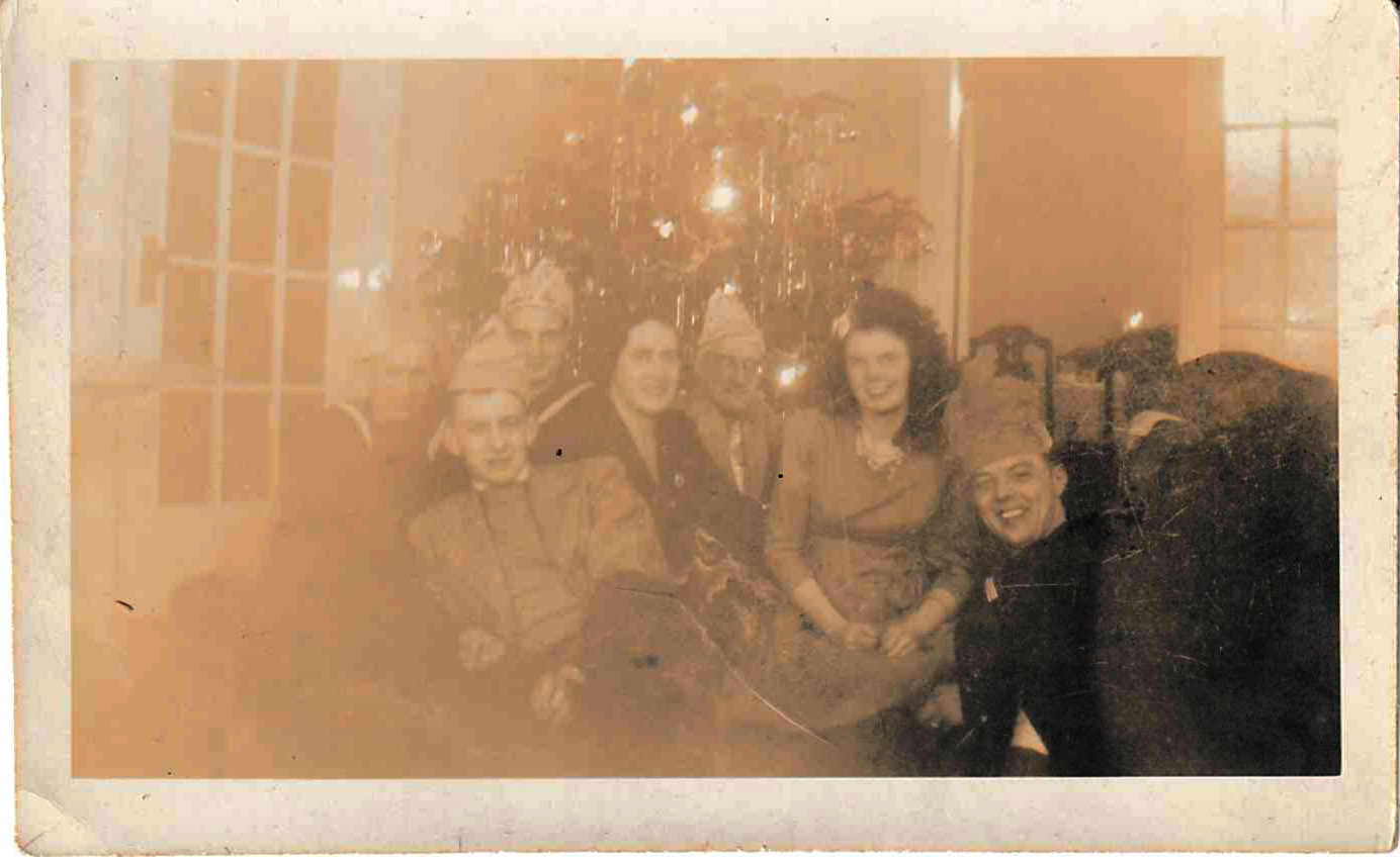 A faded photograph of AB Harrison with friends and family during Christmas of 1943 or 1944.