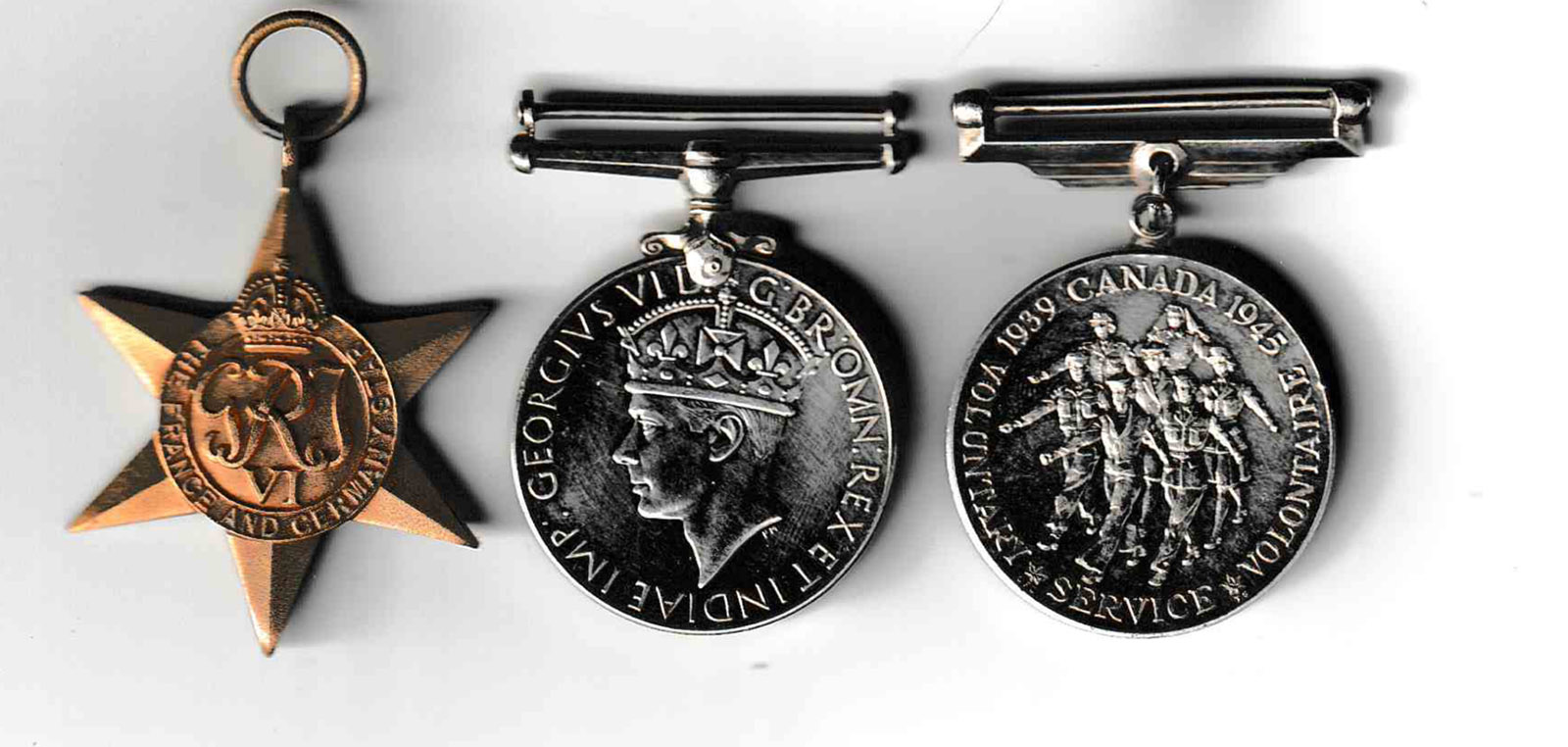 Medals earned by AB Harrison over the course of his service. From left to right they are the France and Germany Star, the War Medal and the Canadian Volunteer Service Medal.