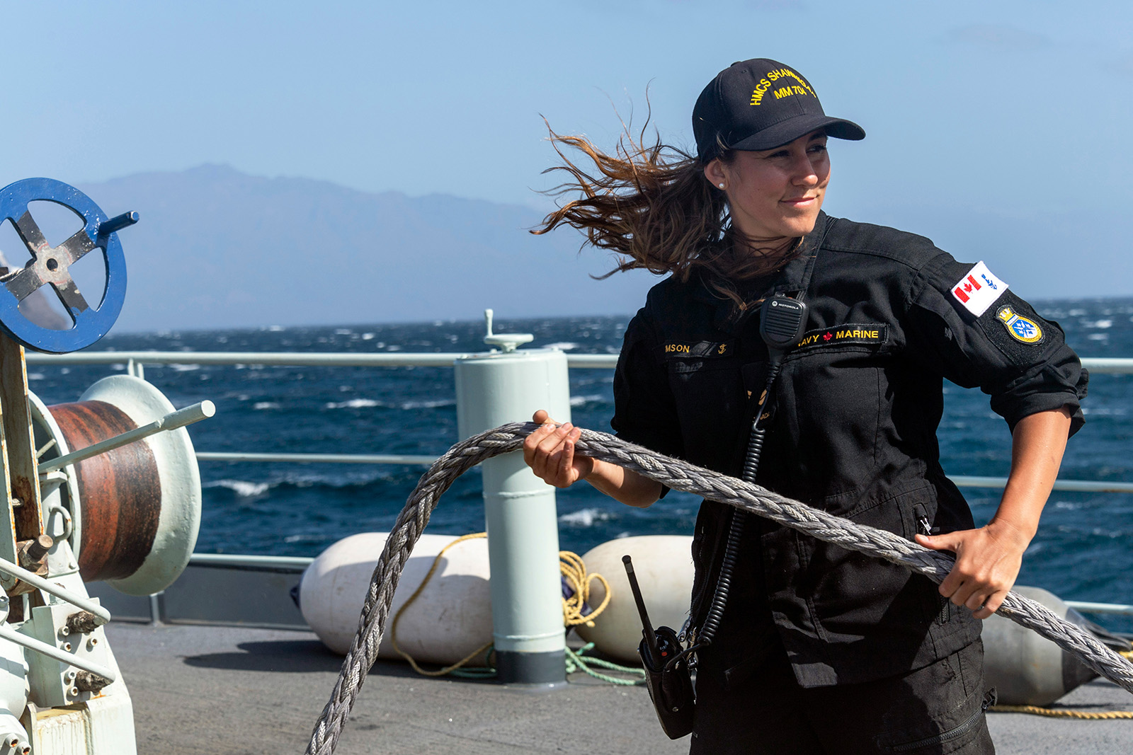 Leading Seaman Josephine Simson, a Boatswain onboard HMCS SHAWINIGAN, dress line while leaving Porto Grande, Cape Verde during Operation PROJECTION Africa on February 20, 2020.